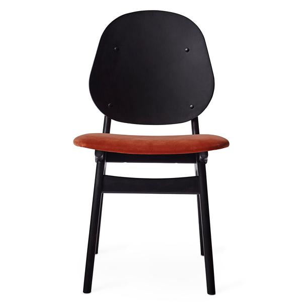 Black wooden chair with a smooth, round back and a warm, rust-colored upholstered seat.