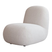 Soft beige lounge chair with a textured, cozy fabric and rounded shape, perfect for modern interiors.