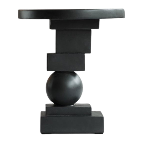 Sleek black side table featuring geometric patterns with a round top and sculptural base. Perfect modern accent piece.