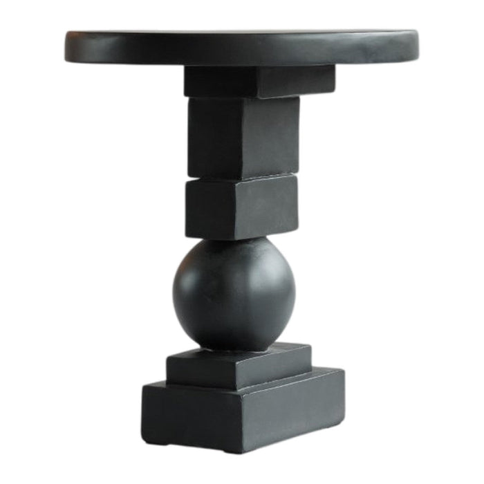 Black minimalist side table featuring geometric shapes with a matte finish. Ideal for modern decor.