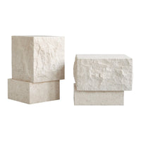 Natural stone blocks in soft beige with textured, rough patterns for a minimalist decor accent.