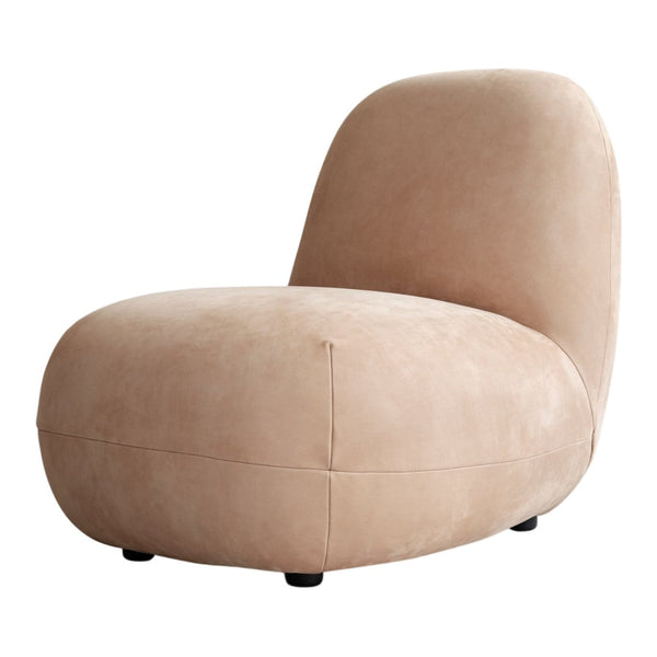 Blush pink velvet lounge chair with a smooth, modern shape and black feet, perfect for contemporary decor.