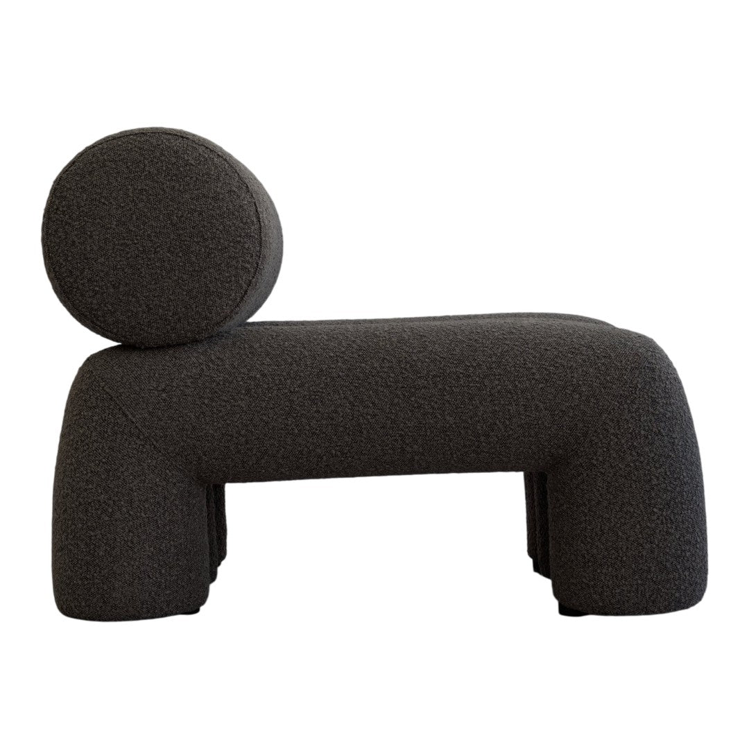 Stylish gray upholstered chair with minimalist design and textured fabric, featuring a rounded backrest.