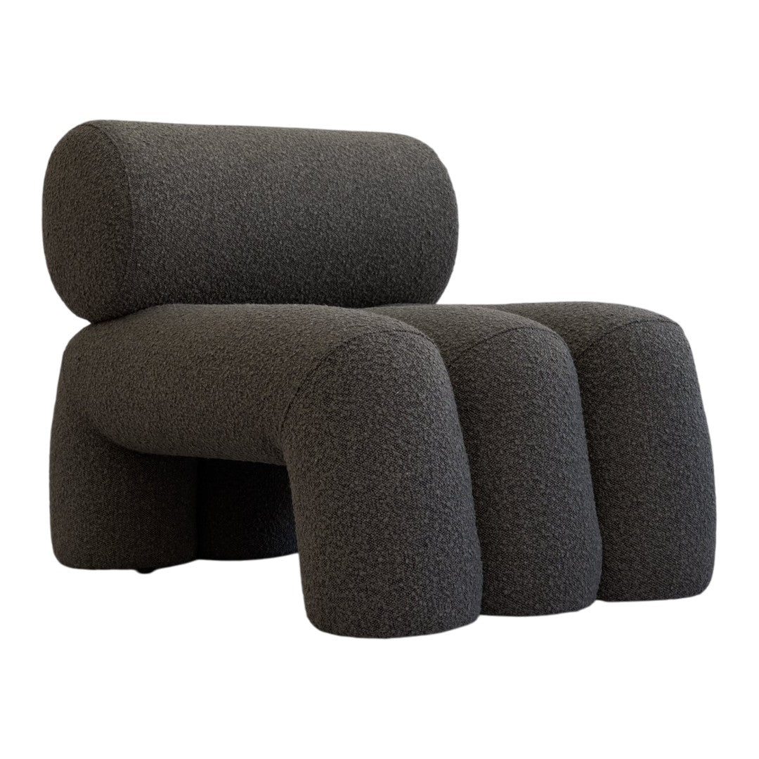 Dark gray textured chair with rounded shapes and a minimalist design, perfect for modern interiors.