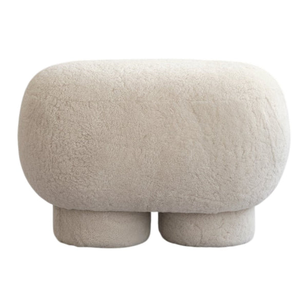 Beige textured pouf with a soft, fluffy finish, perfect for modern decor.