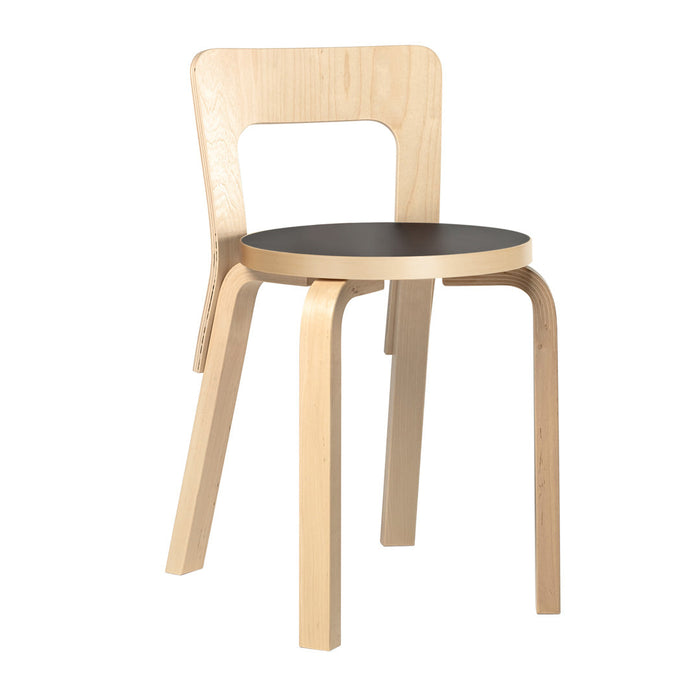 Light wood chair with a smooth, natural finish and a sleek black round seat. Modern and minimalist design.