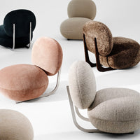 Assorted modern chairs in pink, gray, brown, green, and beige textures against a minimalist background.