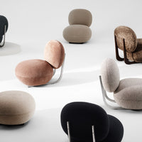 Soft pastel shades and earthy tones blend with varied textures in modern lounge chairs.