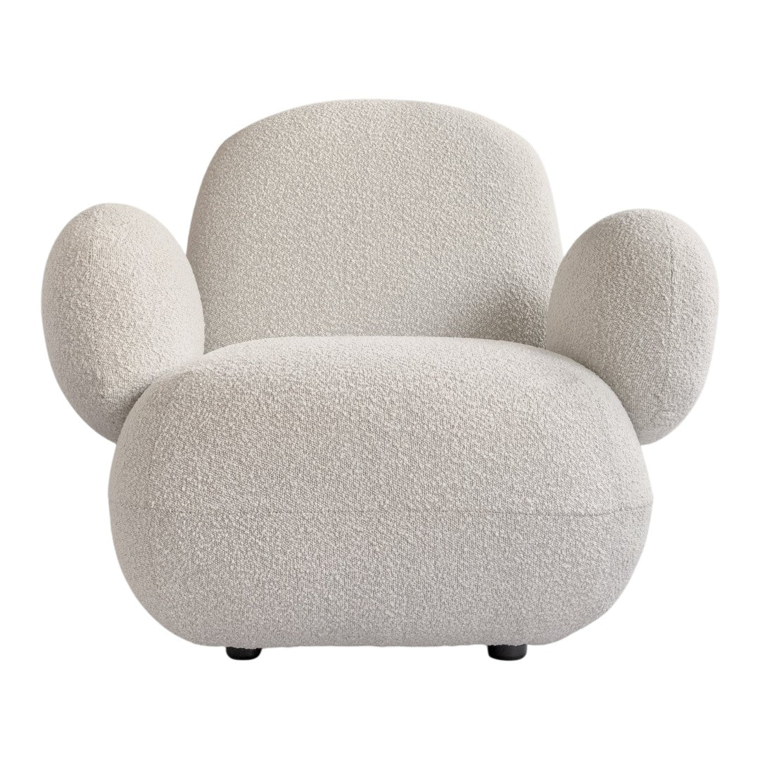Cream-colored chair with a soft, textured fabric and rounded, playful design. Ideal for modern decor.