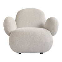 Cream-colored chair with a soft, textured fabric and rounded, playful design. Ideal for modern decor.