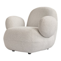 Cream-colored chair with soft, textured fabric and rounded shapes for a cozy, modern look.