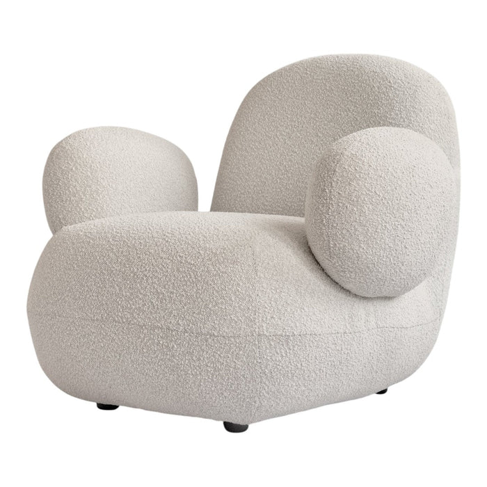 Cream-colored chair with soft, textured fabric and rounded shapes for a cozy, modern look.