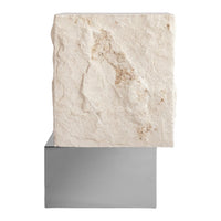 White textured stone atop a sleek, reflective silver base, showcasing natural patterns and subtle earth tones.