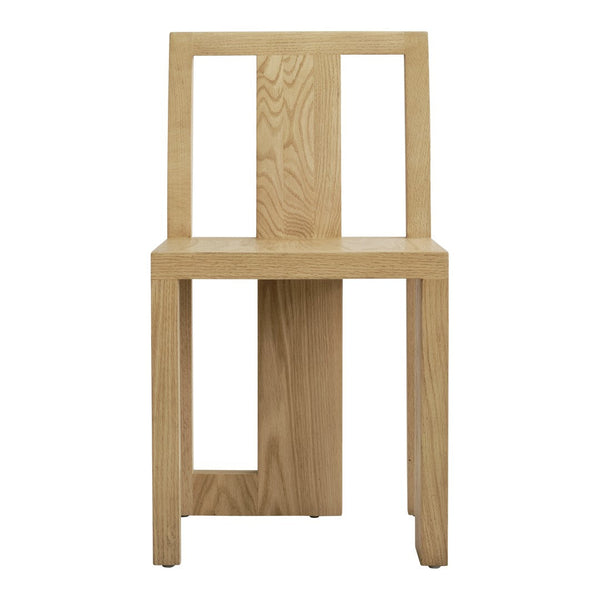 Light oak chair with a minimalist design and natural wood grain pattern. Perfect for modern decor.