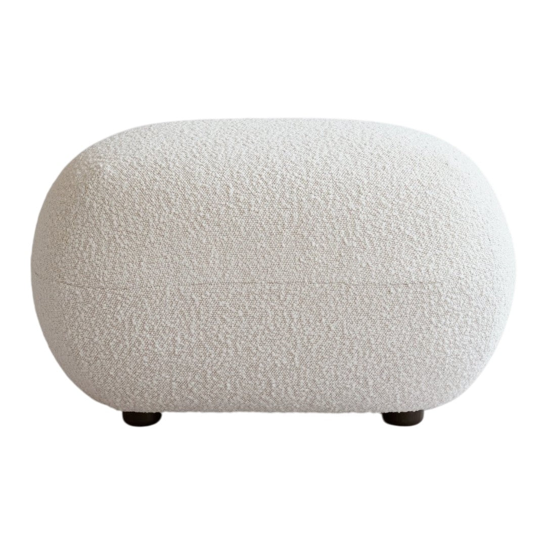 Textured off-white pouf with a soft, neutral palette. Perfect for minimalist and contemporary decor.