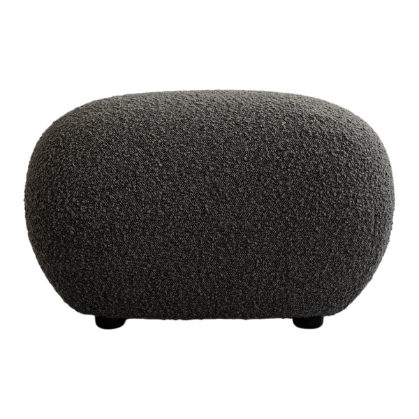 Textured gray ottoman with a rounded shape, featuring a soft, plush fabric pattern for a modern look.