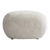 Cream-colored, fluffy ottoman with a soft, textured surface and rounded shape. Ideal for modern decor.