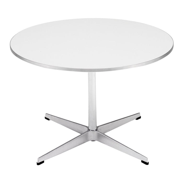 Modern round table with a sleek white top and polished silver base, featuring a minimalist design.