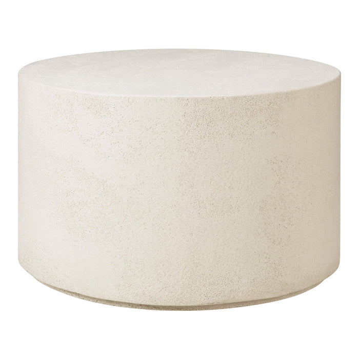 Round concrete coffee table in a soft off-white finish with a smooth, matte texture.