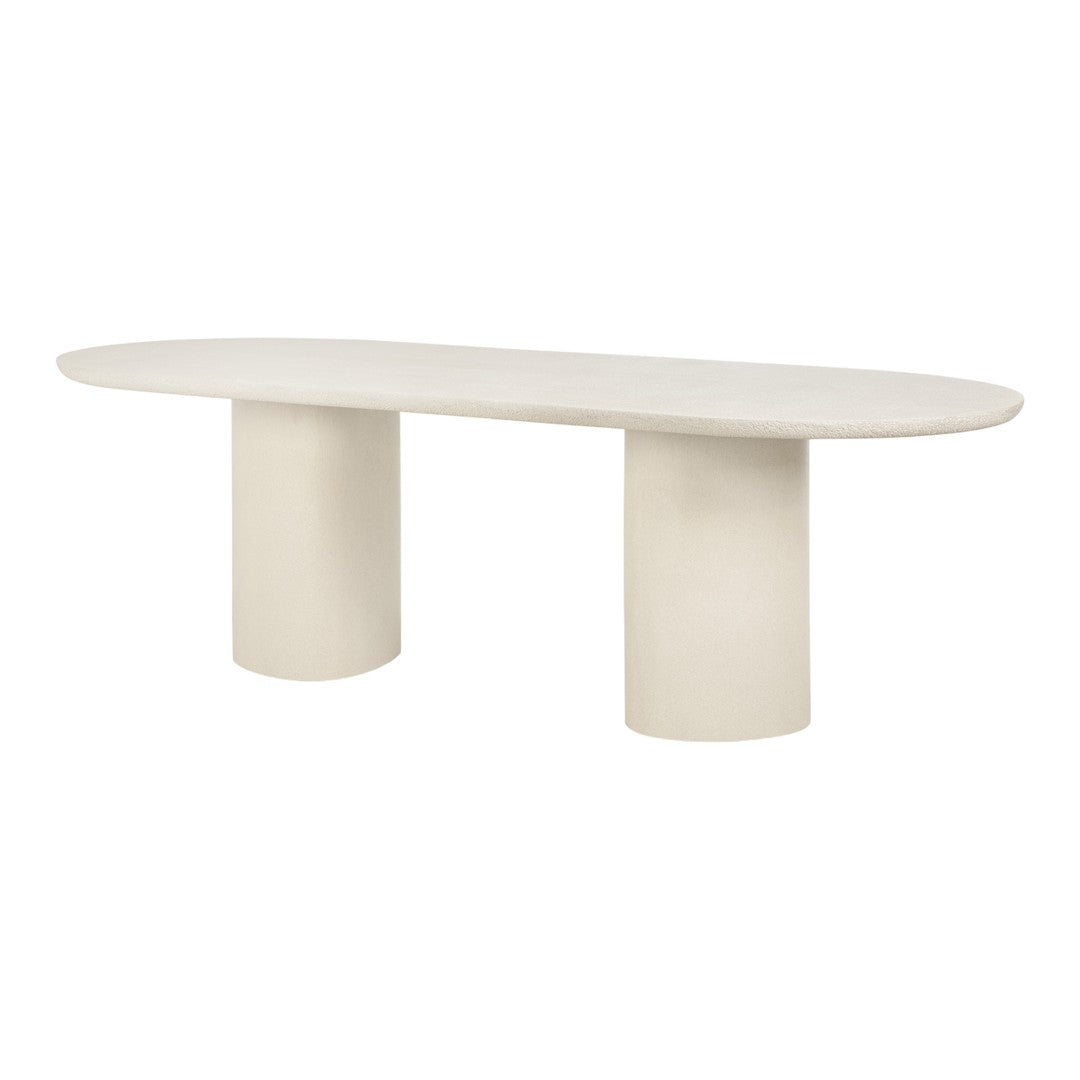 Light beige oval table with a textured finish and cylindrical legs, featuring a minimalist design.