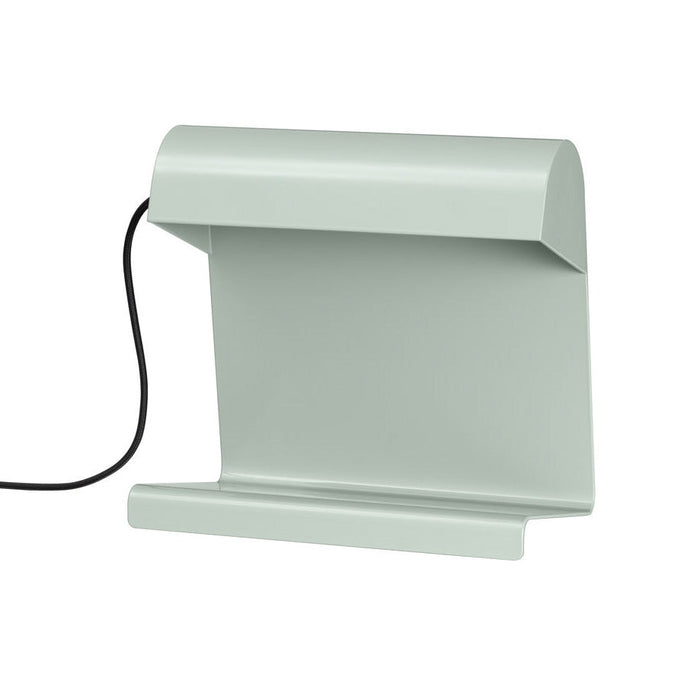 Soft green modern lamp with a minimalist design and smooth, clean lines. Perfect for contemporary spaces.