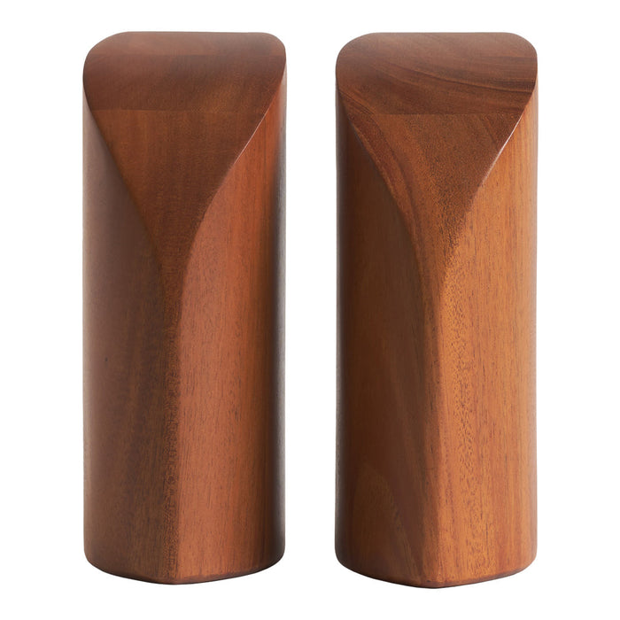 Sleek brown wooden salt and pepper shakers with smooth, curved edges and a minimalist design.