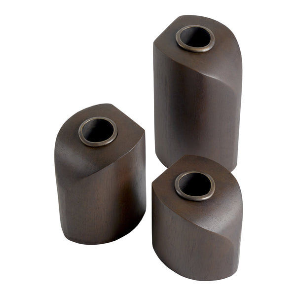 Set of three modern, dark brown vases with smooth, curved shapes and contrasting metallic openings.