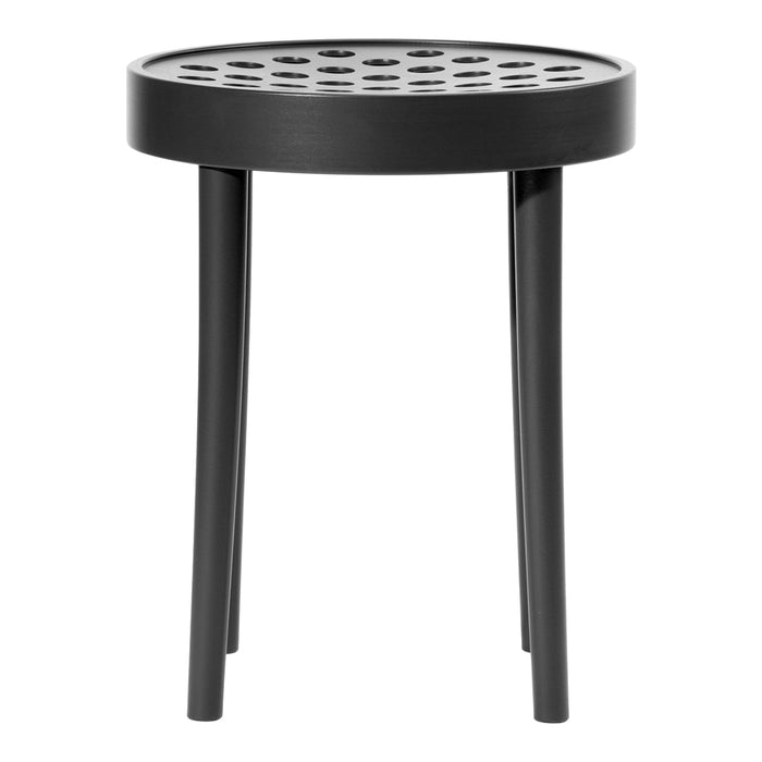 Black round side table with a perforated top and sleek legs, perfect for modern decor.