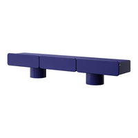 Modern blue block shelf with a smooth finish and cylindrical feet, featuring a minimalist design.