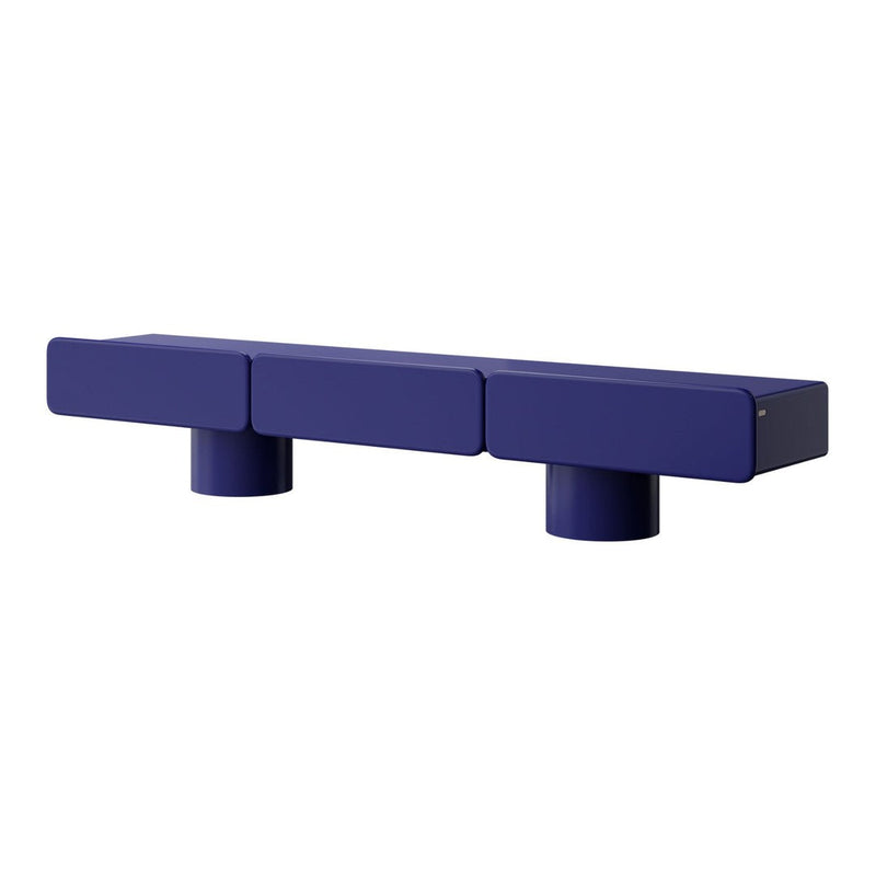 Modern blue block shelf with a smooth finish and cylindrical feet, featuring a minimalist design.