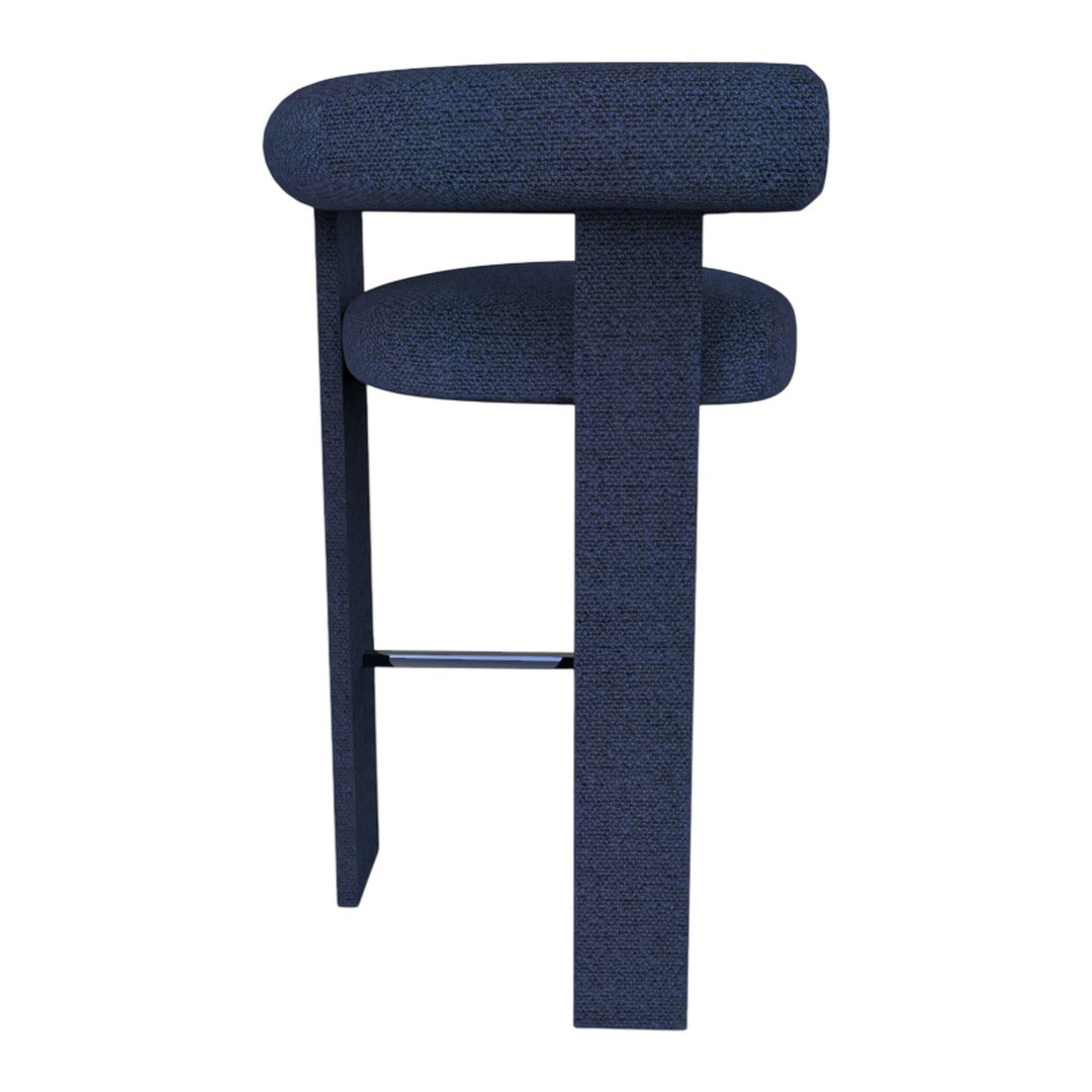 Navy blue crafted bar stool with a textured fabric pattern and sleek black legs, perfect for modern decor.