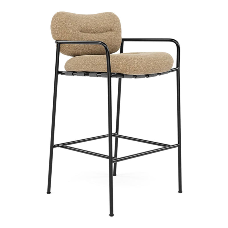 Beige upholstered bar stool with a sleek black metal frame, featuring a minimalist design and smooth curves.
