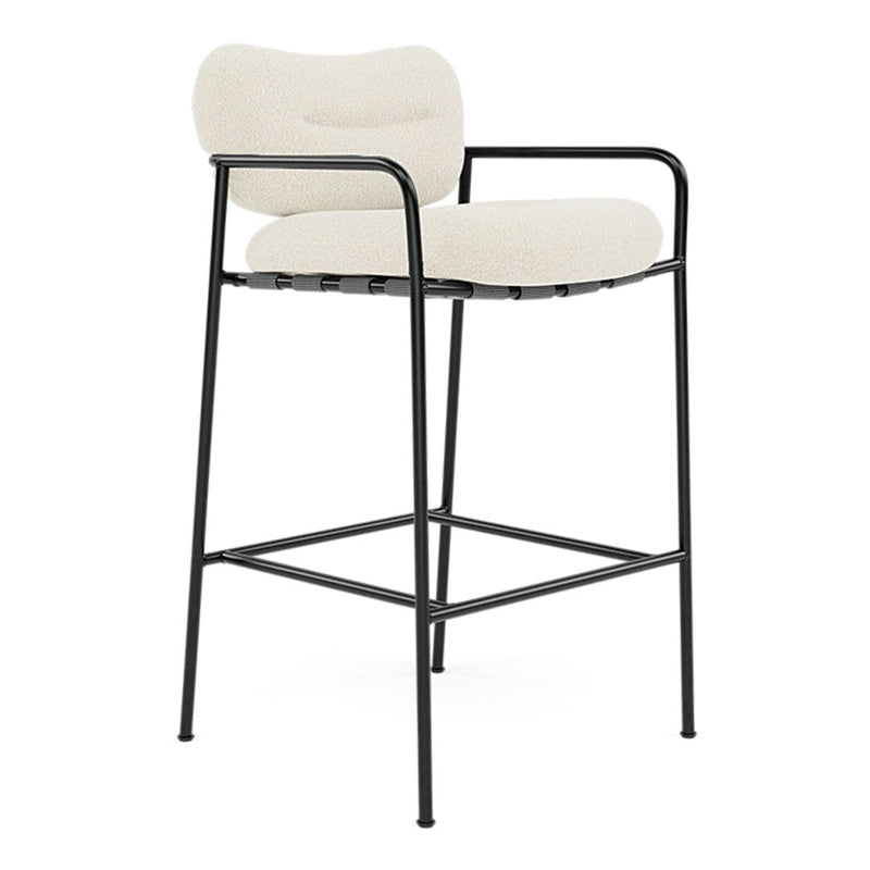 Cream fabric bar stool with a minimalist black metal frame and smooth, curved backrest. Ideal for modern decor.