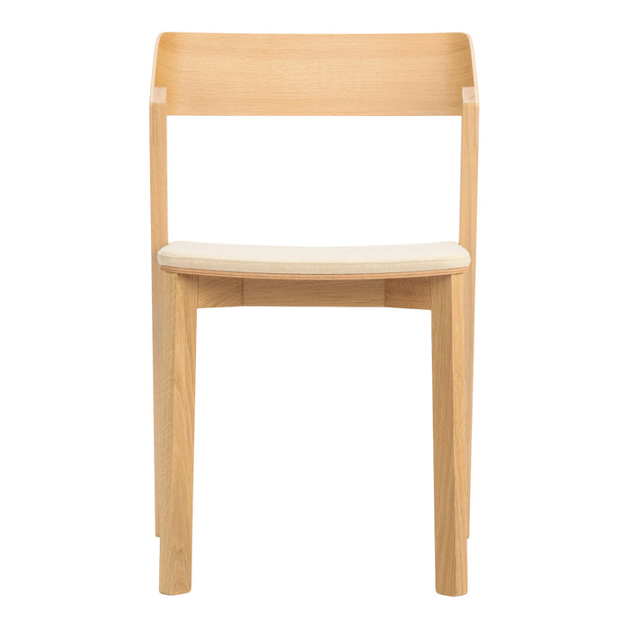 Minimalist wooden chair in natural finish with a light cream seat cushion, showcasing clean lines and simplicity.