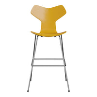 Yellow modern bar stool with a unique angular design and silver metal legs, perfect for contemporary decor.