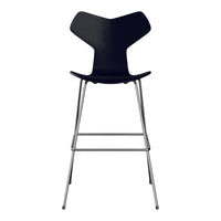 Black wooden chair with a sleek, minimalist design and chrome legs, featuring a smooth, contoured backrest.