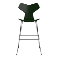 Green modern bar stool with a sleek shape and shiny chrome legs, perfect for any contemporary decor.