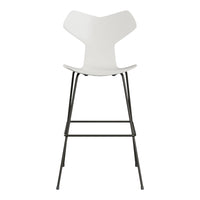 White minimalist bar stool with a sleek design and black metal frame, perfect for modern decor.