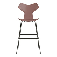 Modern bar stool in deep mauve with a sleek black metal frame, showcasing a minimalist design.