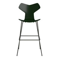 Green bar stool with a unique, modern design and sleek black metal frame. Perfect for contemporary spaces.