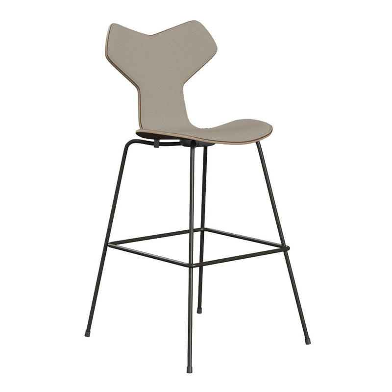 Modern beige bar stool with a unique angular back design and black metal frame, ideal for contemporary decor.