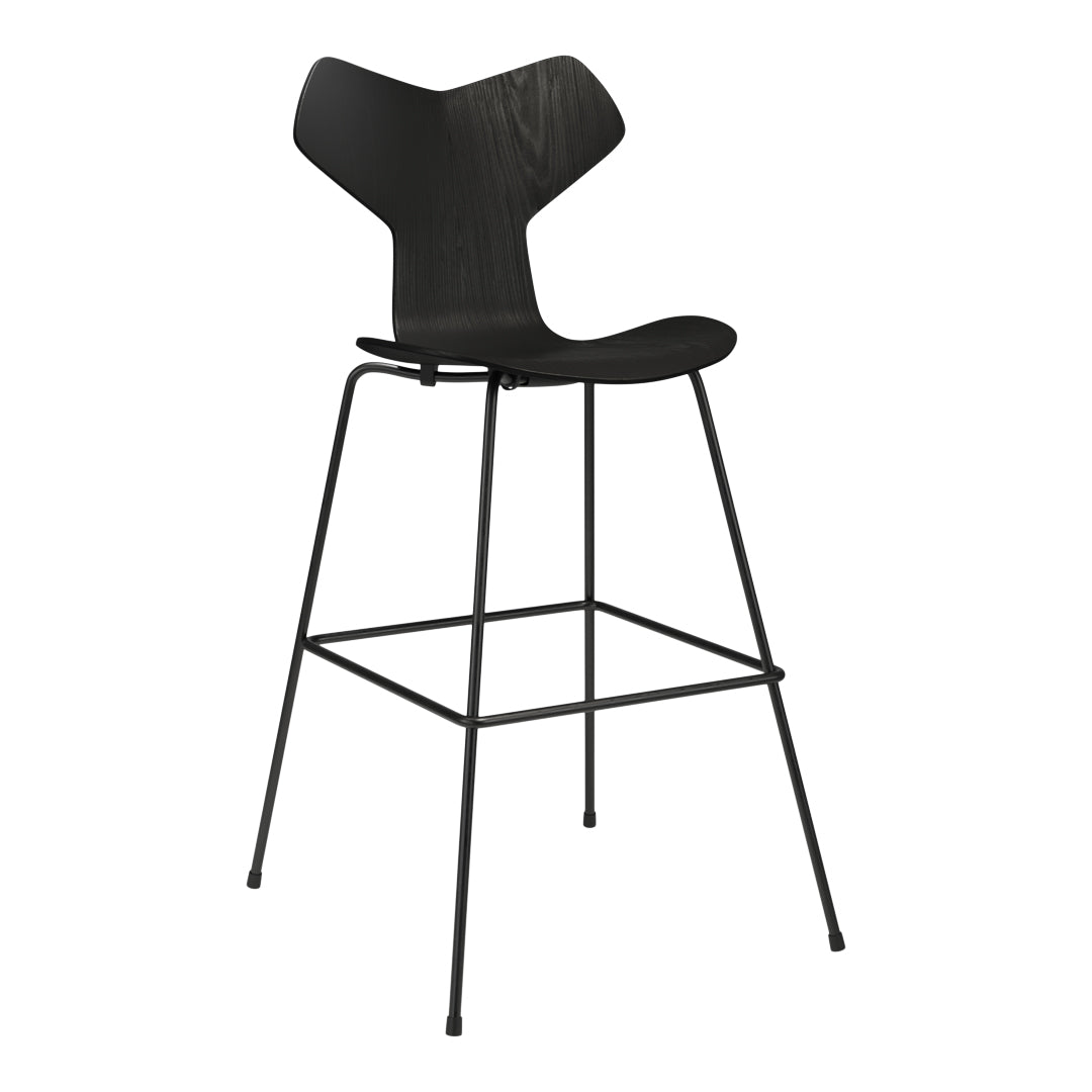 Black bar stool with a modern design, featuring a sleek, minimalist silhouette and stylish, textured seat.
