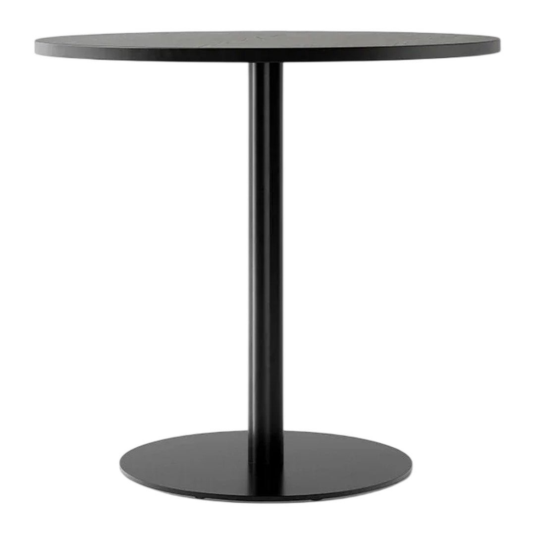 Black round table with a sleek, minimalist design and a smooth matte finish. Ideal for modern decor.