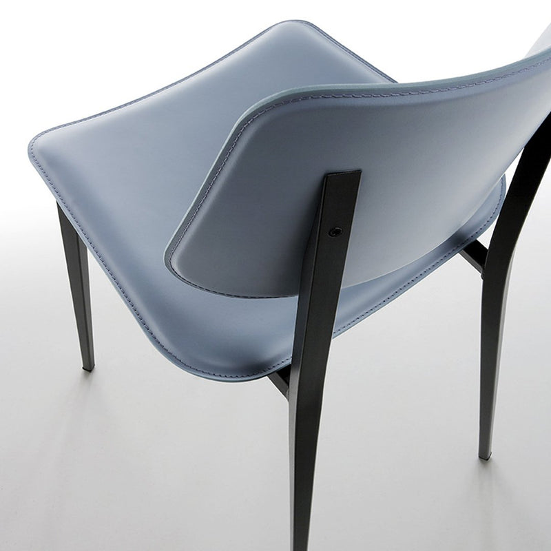Light blue chair with smooth curves and black legs, featuring a sleek, modern design perfect for contemporary decor.