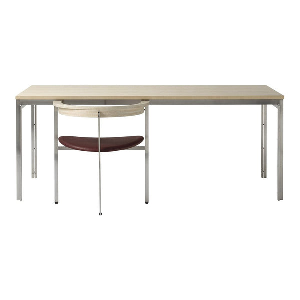 Modern desk with a light beige top, chrome legs, and a stylish chair featuring a wood seat in deep burgundy.