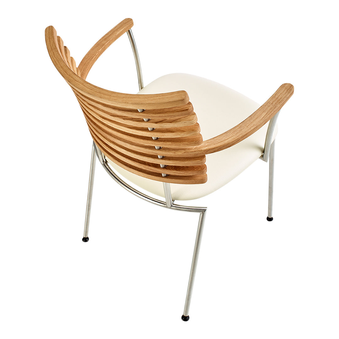 Modern chair featuring wooden slatted backrest and a sleek white seat, with metal legs and minimalist design.