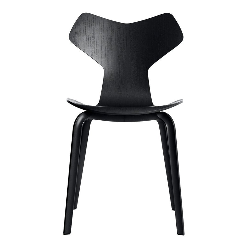 Stylish black chair with a sleek, modern design and minimalistic shape, perfect for contemporary interiors.
