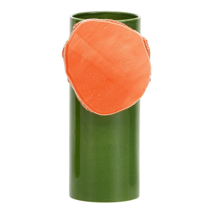 Green cylindrical vase with an orange, textured accent. Modern design with vibrant color contrast.
