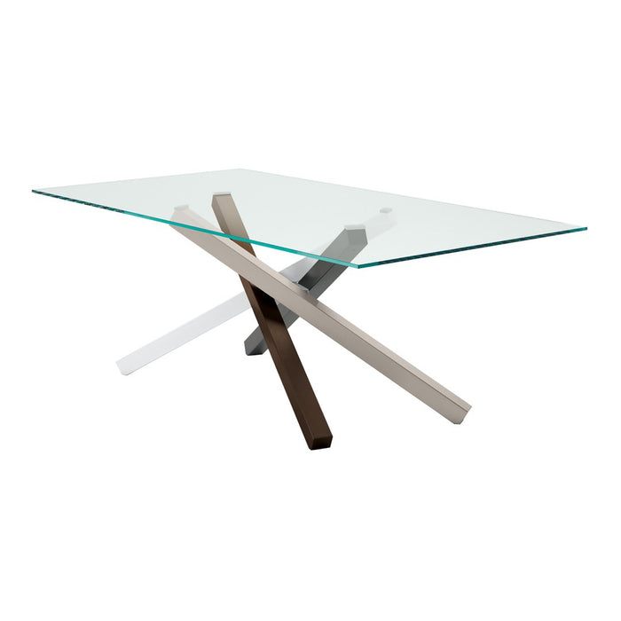 Modern glass dining table with crossed metal legs in silver, black, and a natural wood finish. Minimalist design.