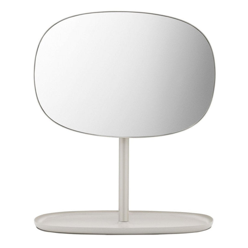 Minimalist oval mirror with a sleek white frame and base, featuring a smooth, reflective surface.